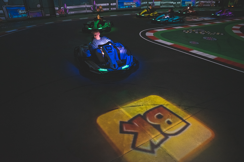 BattleKart player in their kart going to drive over a yellow bonus square